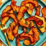 Roasted acorn squash recipe on a plate.