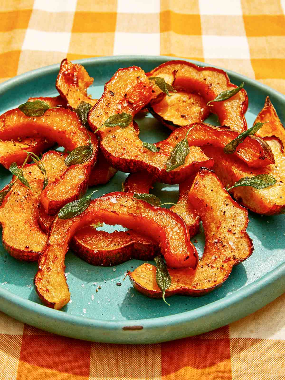 Roasted acorn squash recipe on a plate.