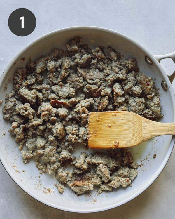 Cooking breakfast sausage in a skillet.