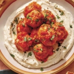Air fryer turkey meatballs on a plate with bread on the side.