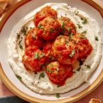 Air fryer turkey meatballs on a plate with bread on the side.