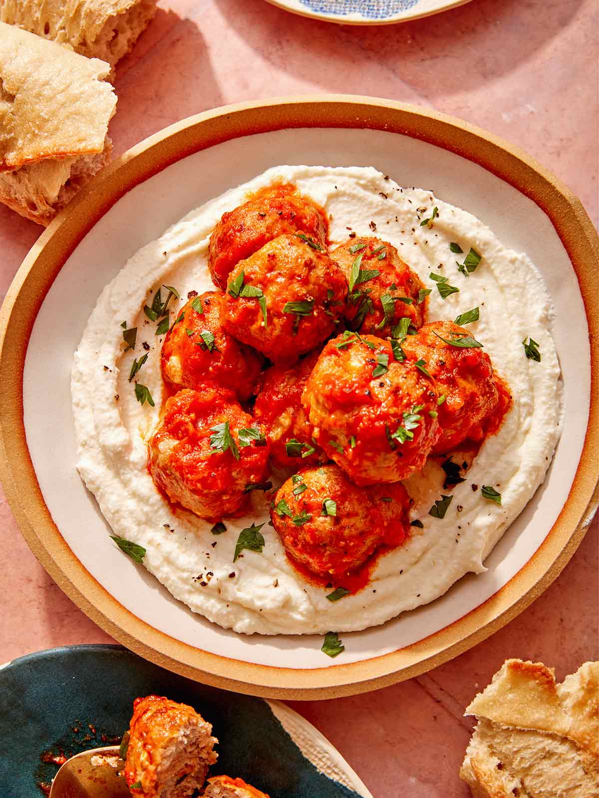 Air fryer turkey meatballs on a plate with bread on the side.