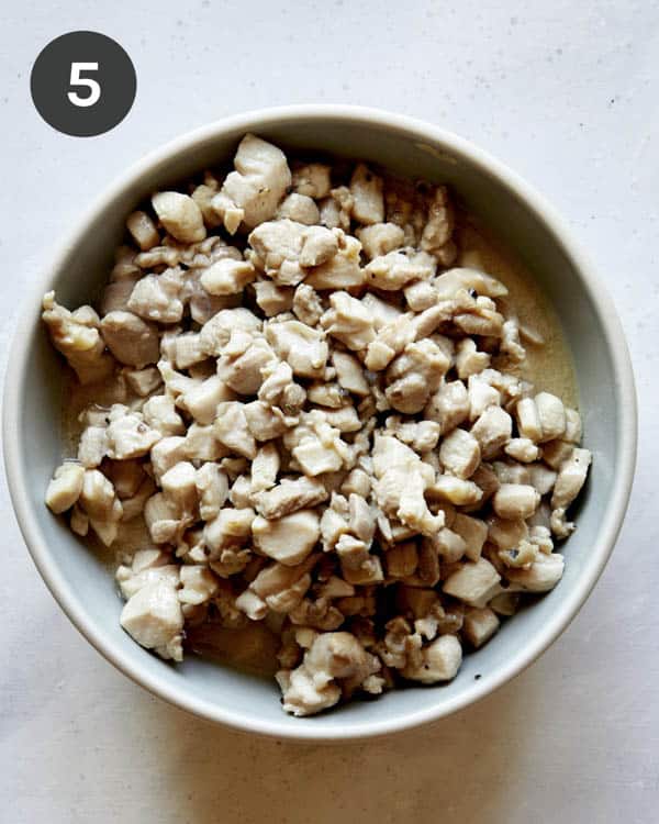 Diced chicken thighs in a bowl for chicken lettuce wraps.