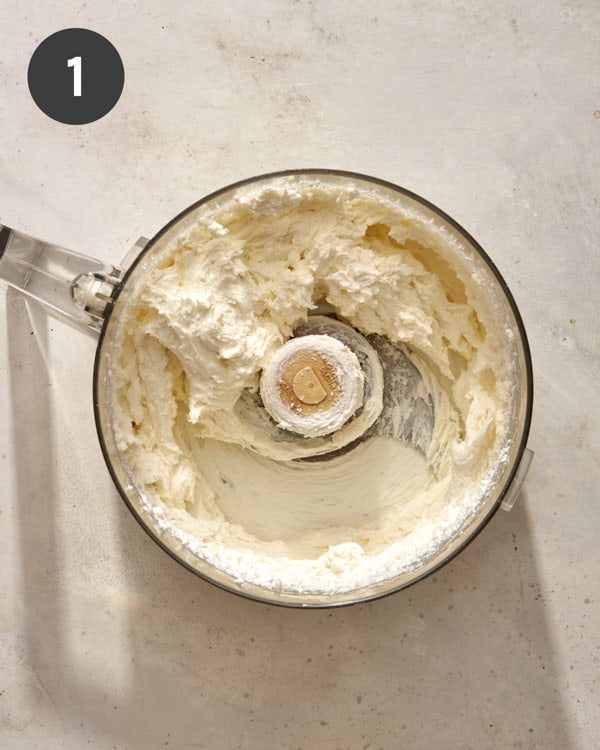 Whipped goat cheese in a food processor. 