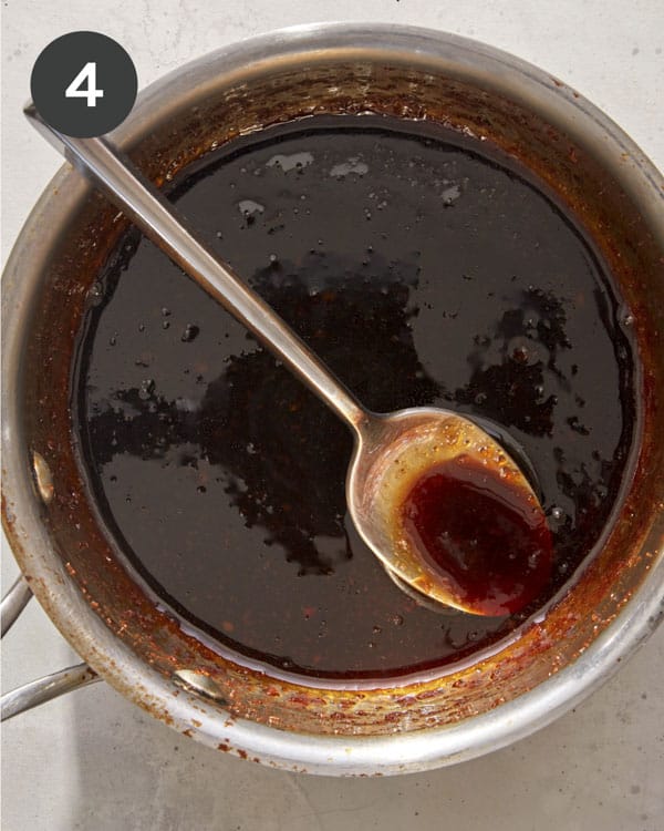 Honey garlic sauce in a pot being simmered.