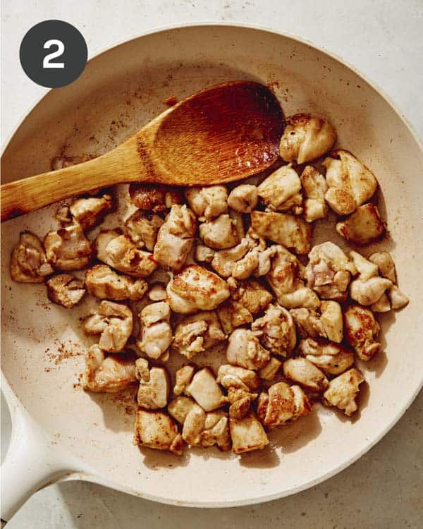 Chicken thighs cooked in a skillet. 