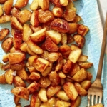 Crispy roasted potatoes on a platter.