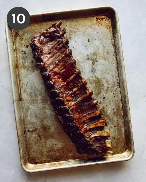 Oven baked ribs on a baking sheet.