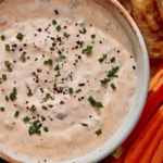 Spicy dill pickle dip in a bowl.