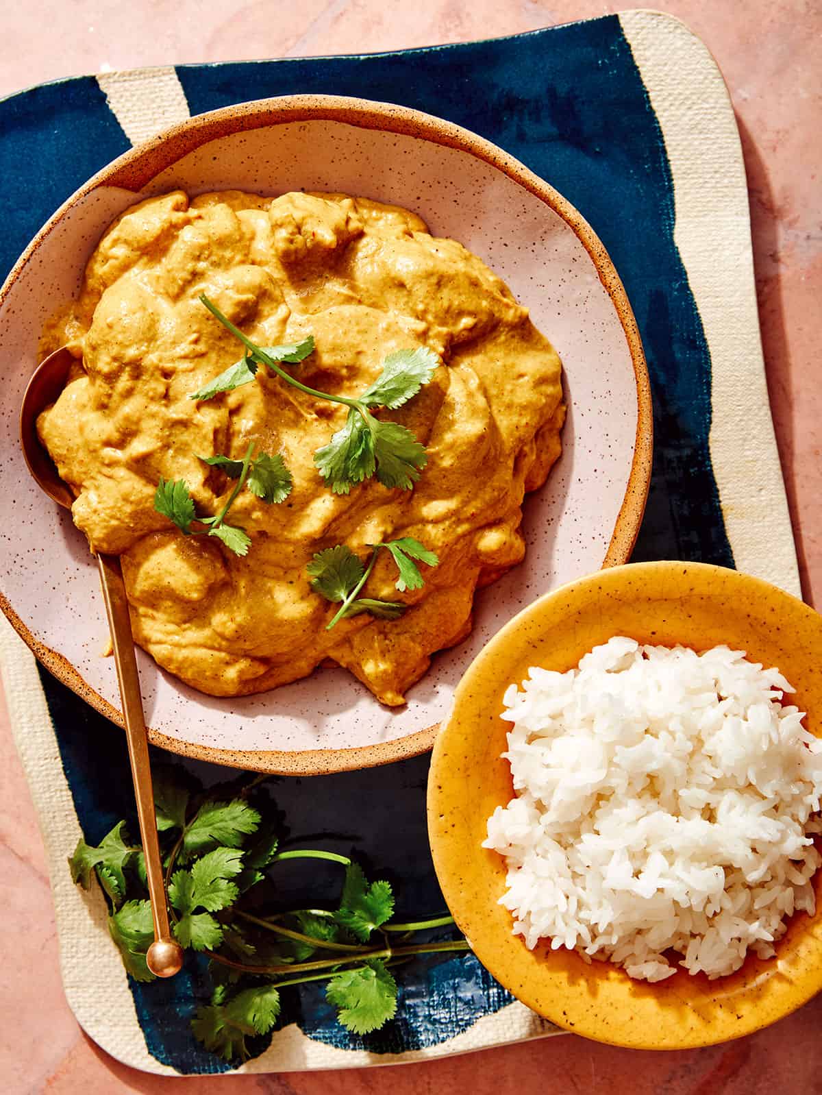 Chicken Korma recipe with rice and some cilantro. 