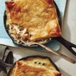Easy chicken pot pie recipe made in a skillet with a fork in it.