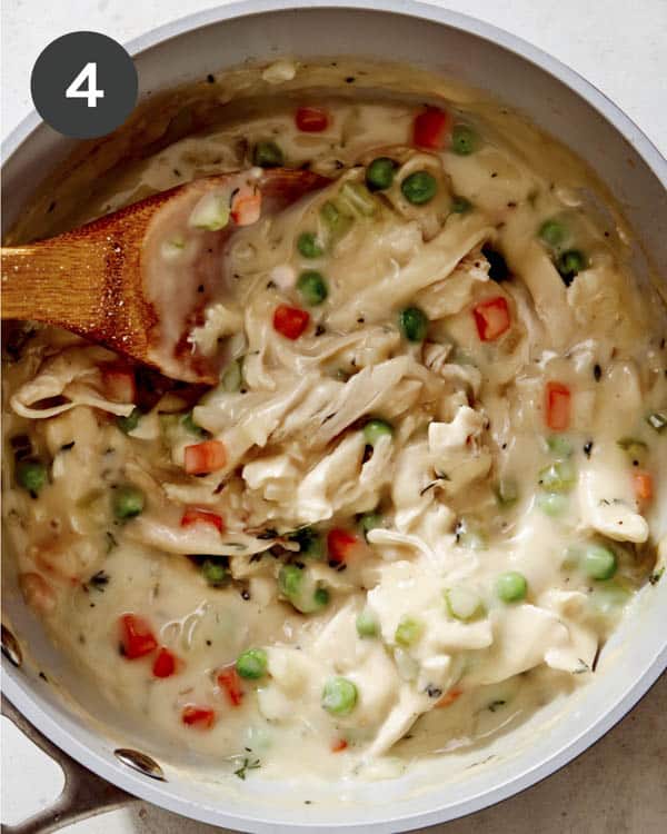 Chicken pot pie filling in a pot simmering. 