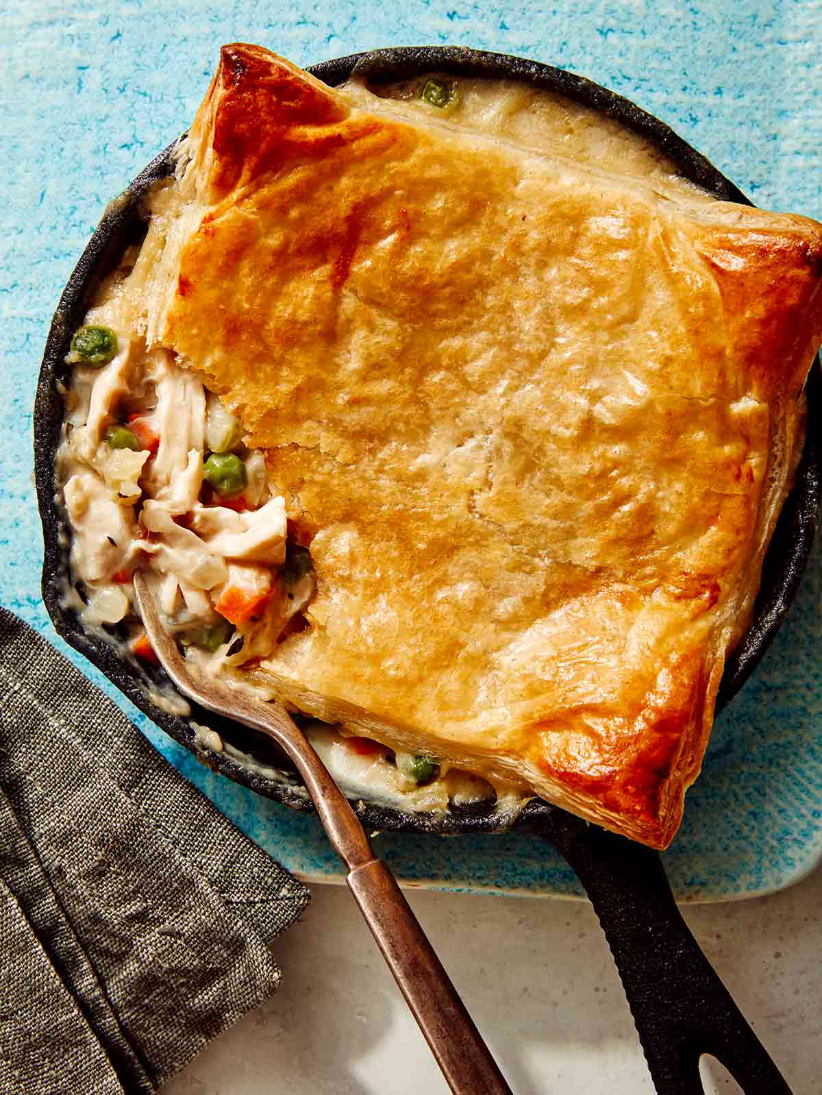 Close up on a chicken pot pie in a skillet. 