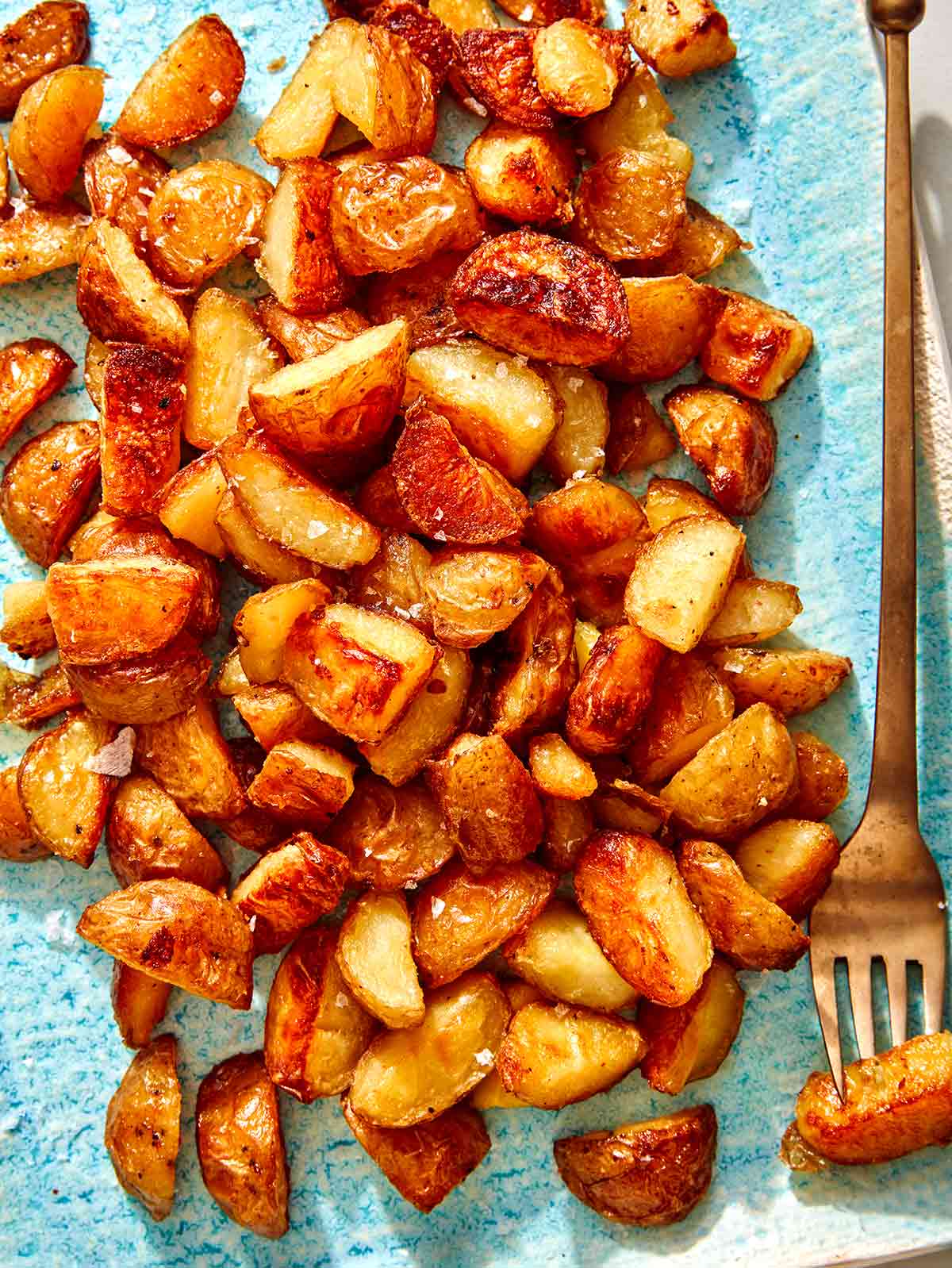 Crispy roasted potatoes on a platter. 