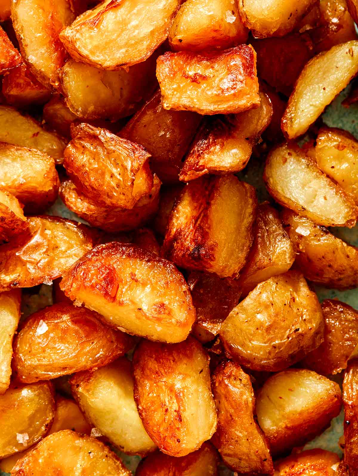 Crispy roasted potatoes close up.