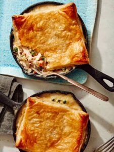 Easy chicken pot pie recipe made in a skillet with a fork in it.