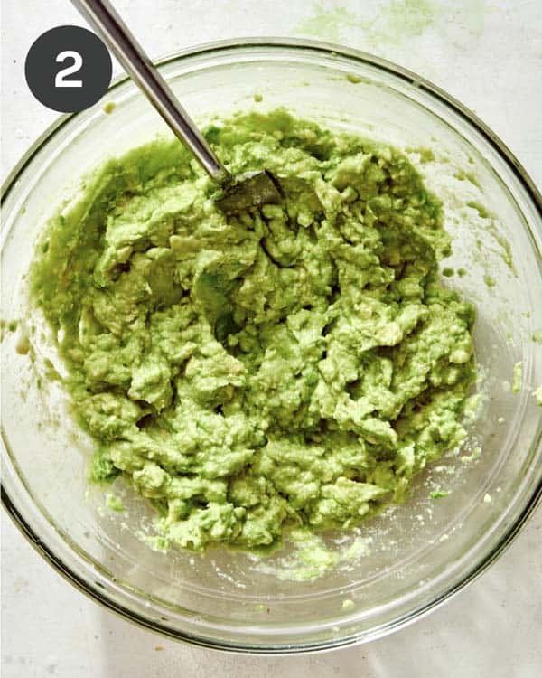 Avocado mashed together in a bowl. 
