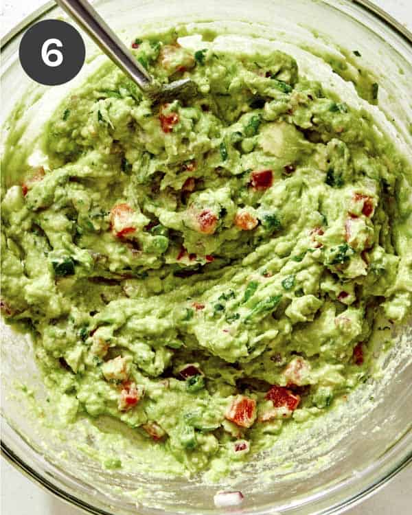 Guacamole all mixed up in a bowl ready to be served. 