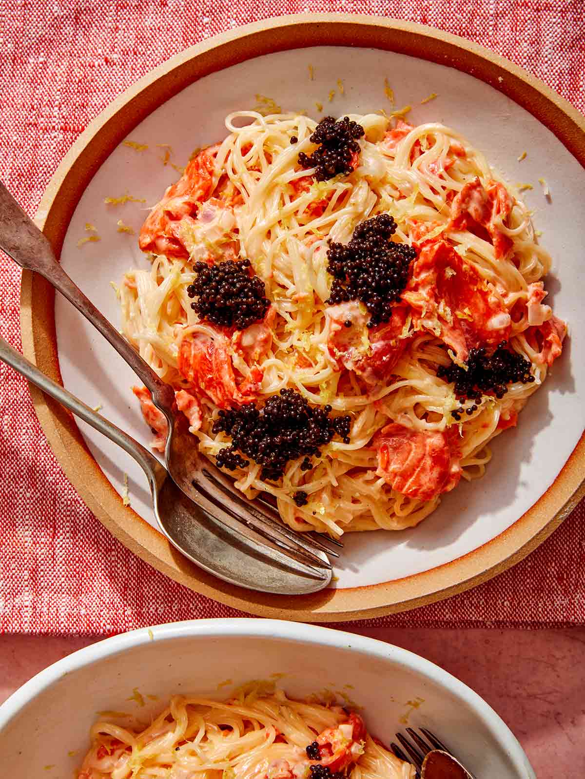 Smoked salmon pasta in two bowls.