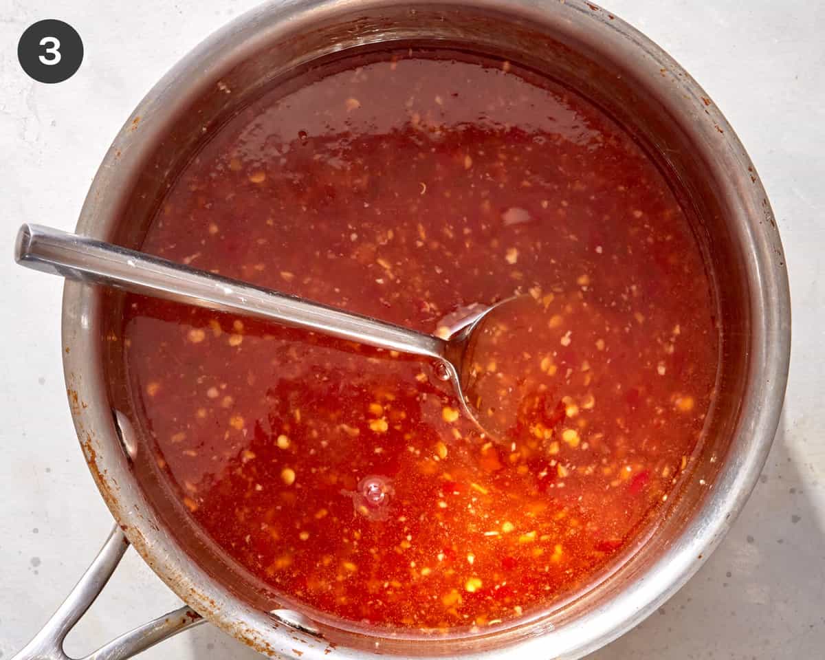Sweet chili sauce cooling in a pot to thicken up. 