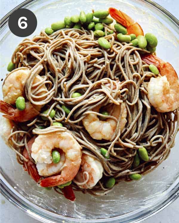 Soba noodles with shrimp in a glass bowl. 
