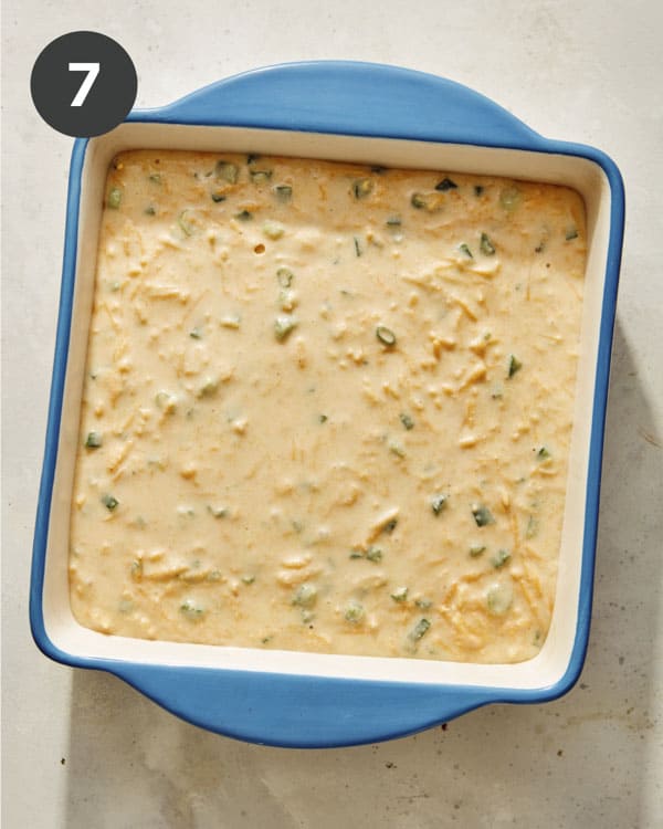 Spoon bread batter in a baking dish. 