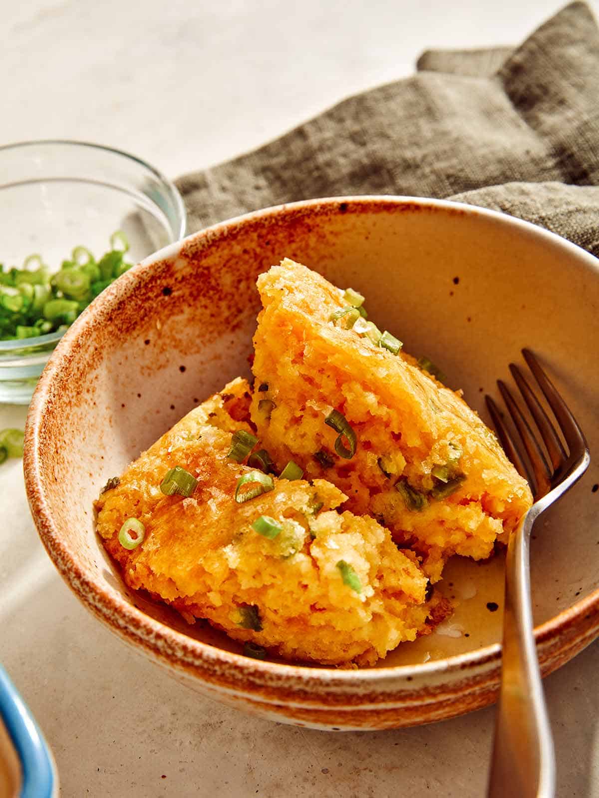 Jalapeno cheddar spoon bread in a bowl. 