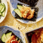 Sushi bake being scooped out with a spoon.