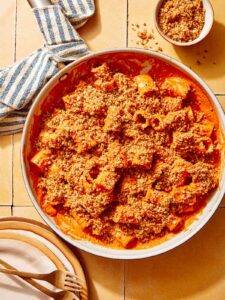 Romesco sauce pasta in a skillet ready to be served.