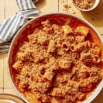 Romesco sauce pasta close up in a skillet.