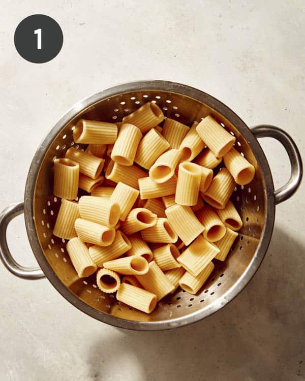 Cooked pasta in a colander. 