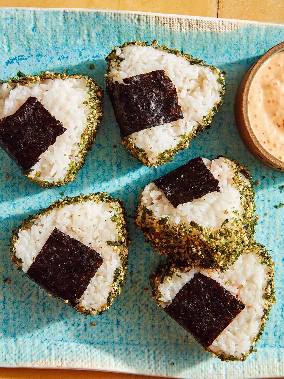 Spicy tuna onigiri on plate.