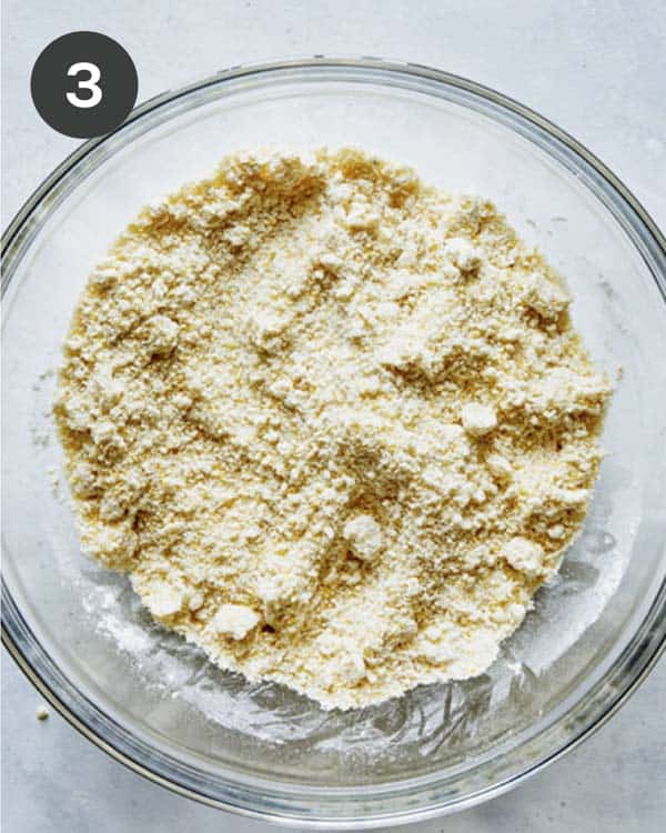 Biscuit ingredients for strawberry shortcake mixed together in a bowl.