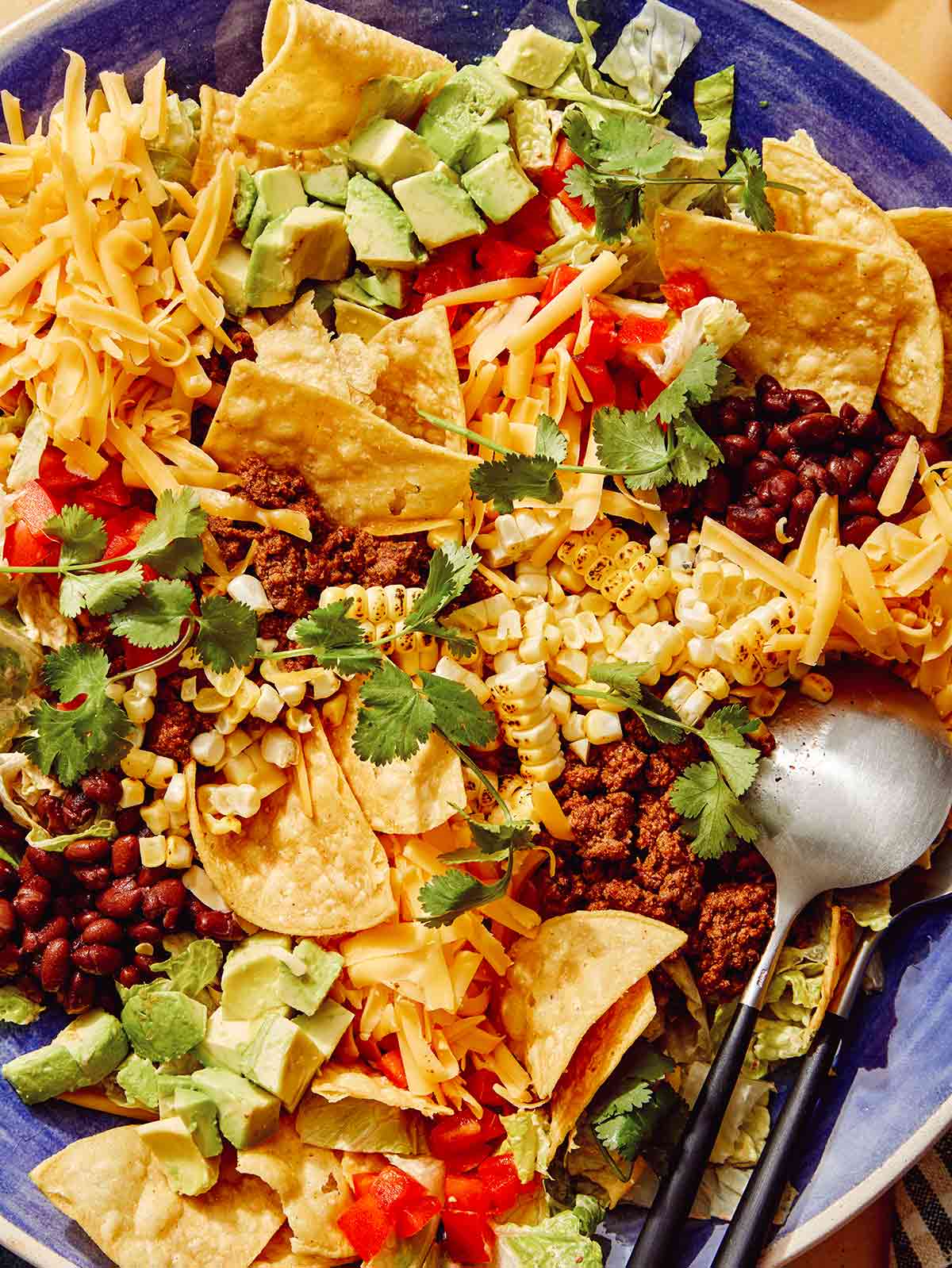 Close up on a taco salad in a big bowl.