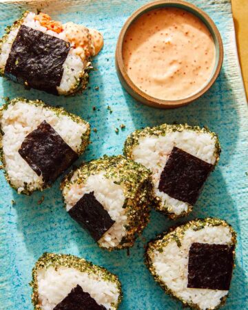 Spicy Tuna Onigiri recipe on a plate with masago sauce.
