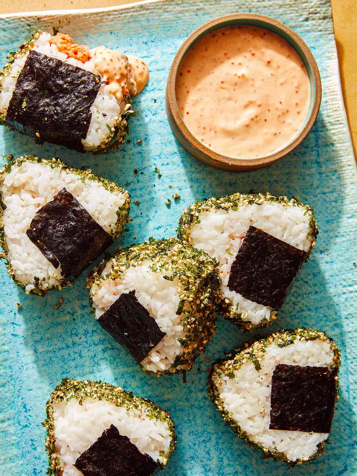 Spicy Tuna Onigiri recipe on a plate with masago sauce.