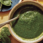 Basil vinaigrette recipe in a bowl ready to be drizzled on a salad.