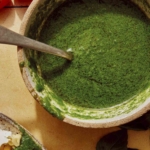 Basil vinaigrette recipe in a bowl ready to be drizzled on a salad.