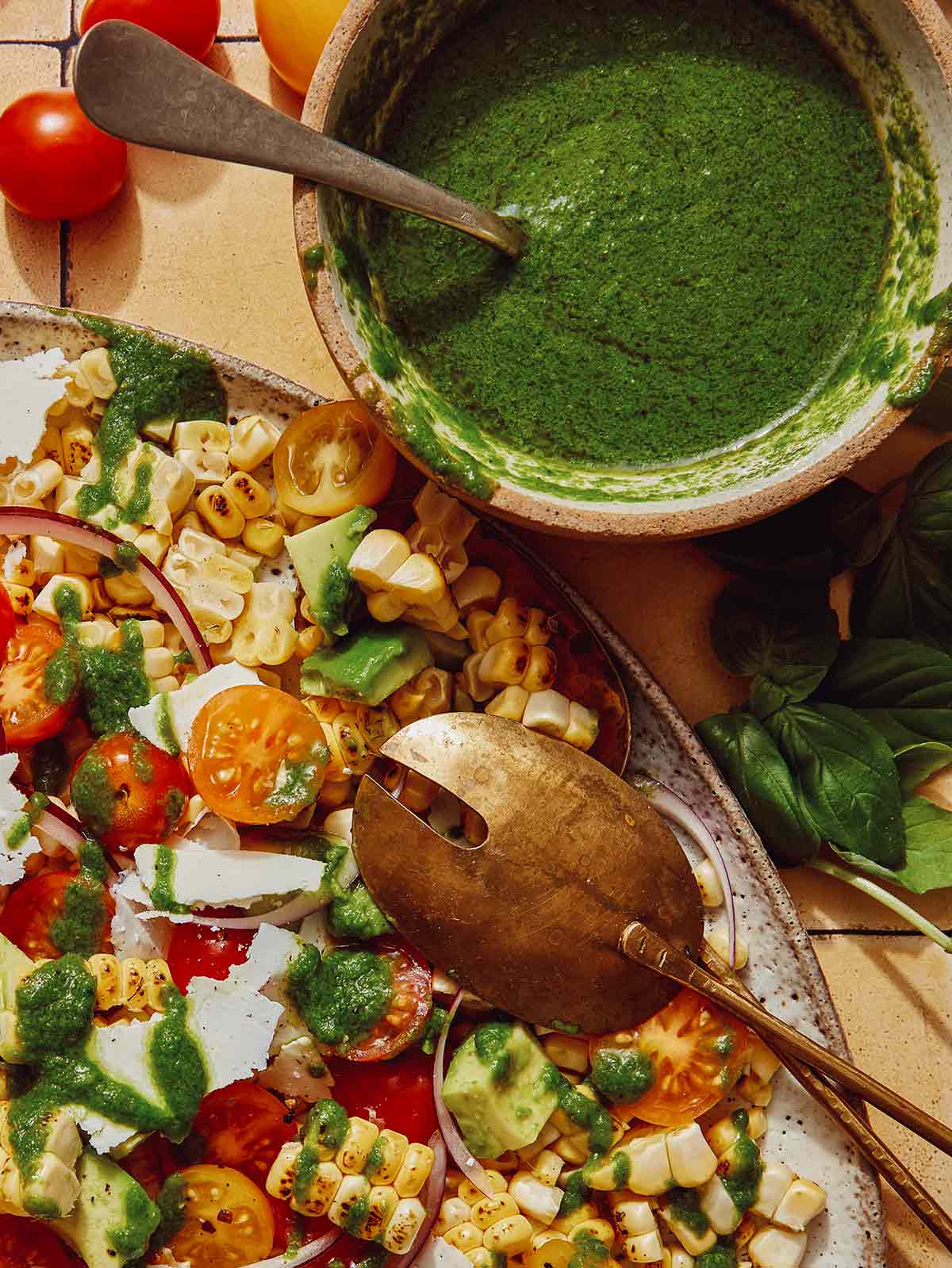 Basil vinaigrette recipe next to a corn salad.