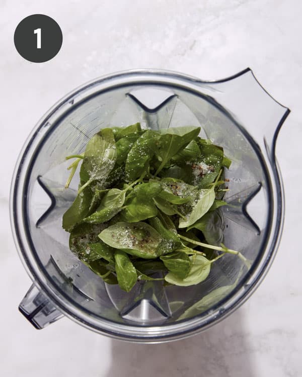 Basil vinaigrette ingredients in a blender.