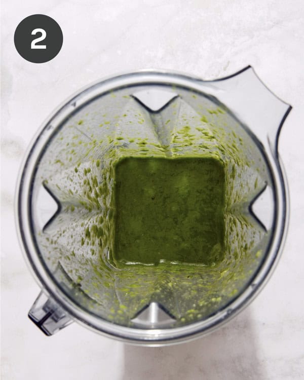 Basil vinaigrette dressing in a blender.