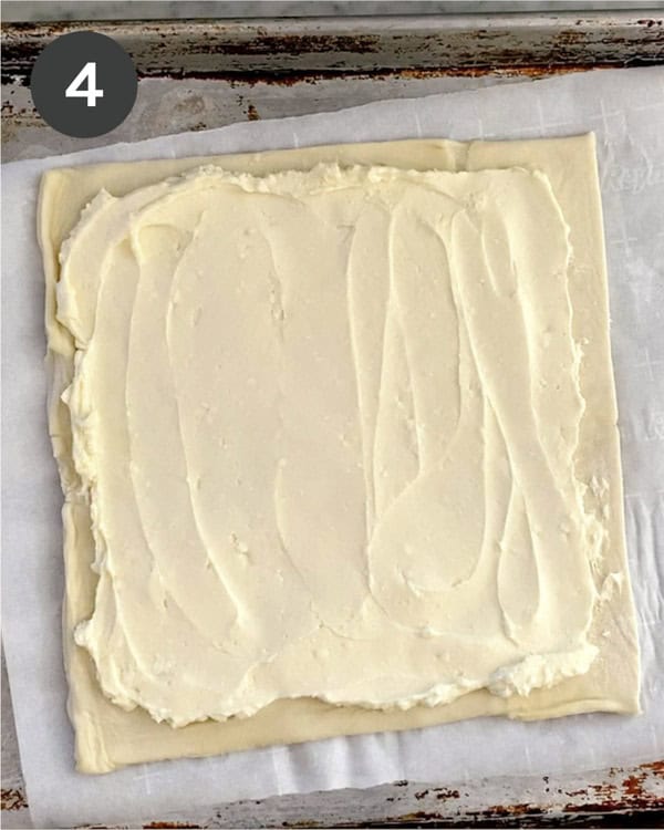 Raw puff pastry spread with honey and cream cheese.