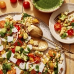 Corn salad being served onto a plate.