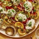 Tomato salad on a plate with some served.