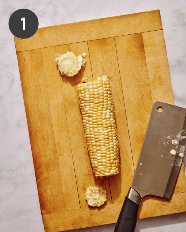 Cutting corn ribs out of a cob.