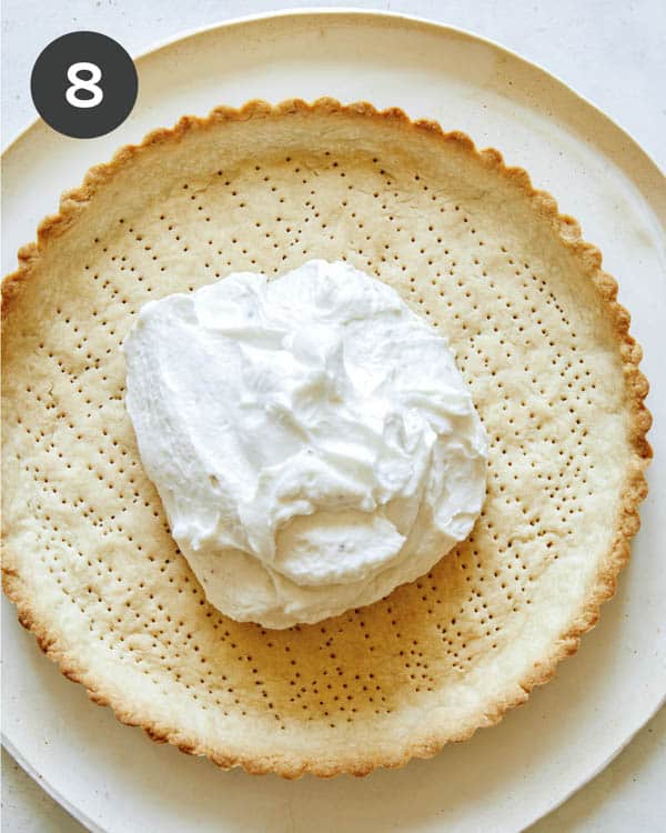 Tomato tart shell with filling inside.