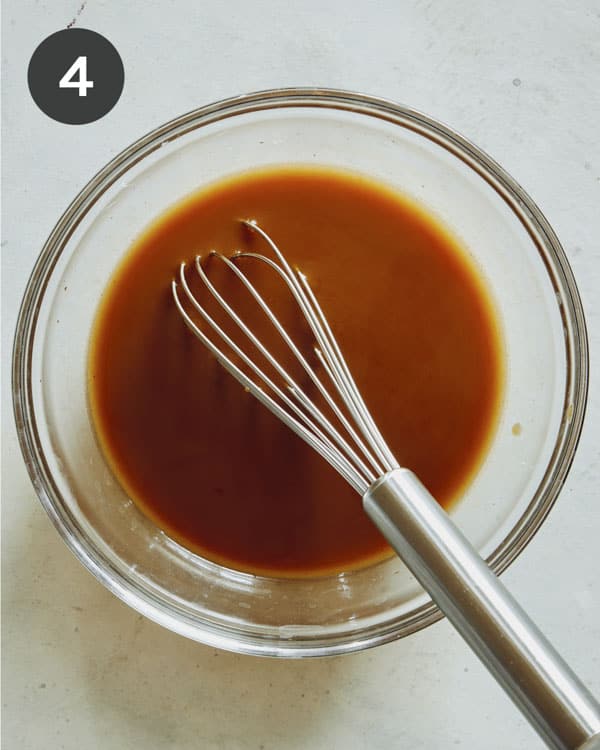 Szechuan beef sauce whisked together in a bowl.