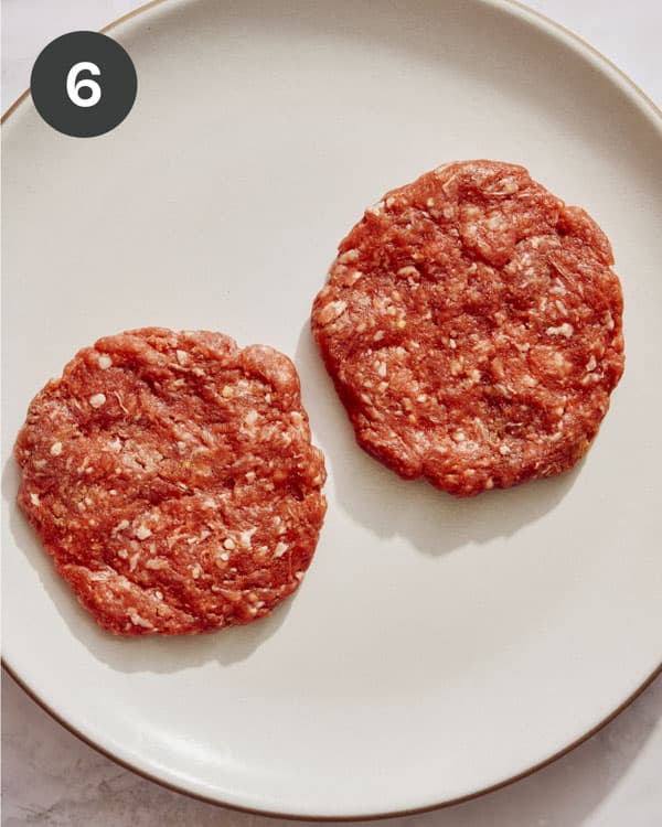 Hamburger patties formed and placed on a plate.