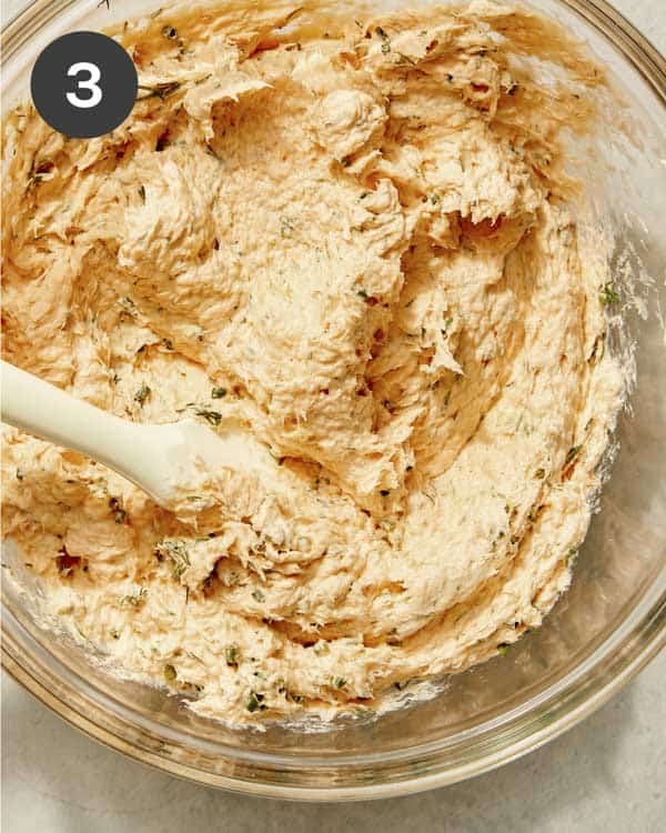 Smoked salmon ingredients in a bowl mixed together.