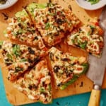 Sushi pizza recipe on a cutting board.